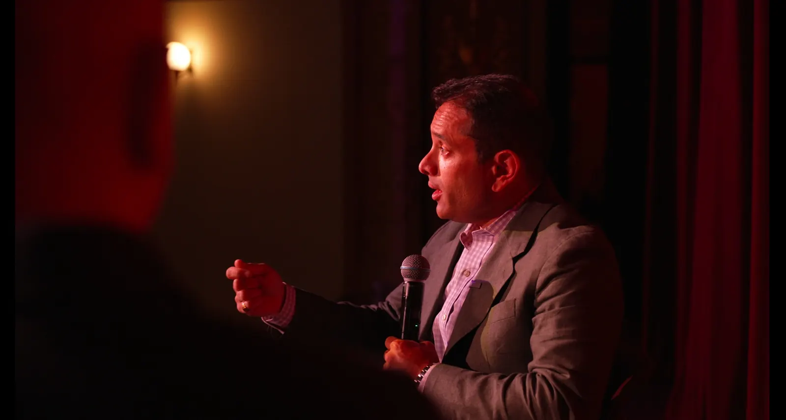 Nik Agharkar speaking at a live event