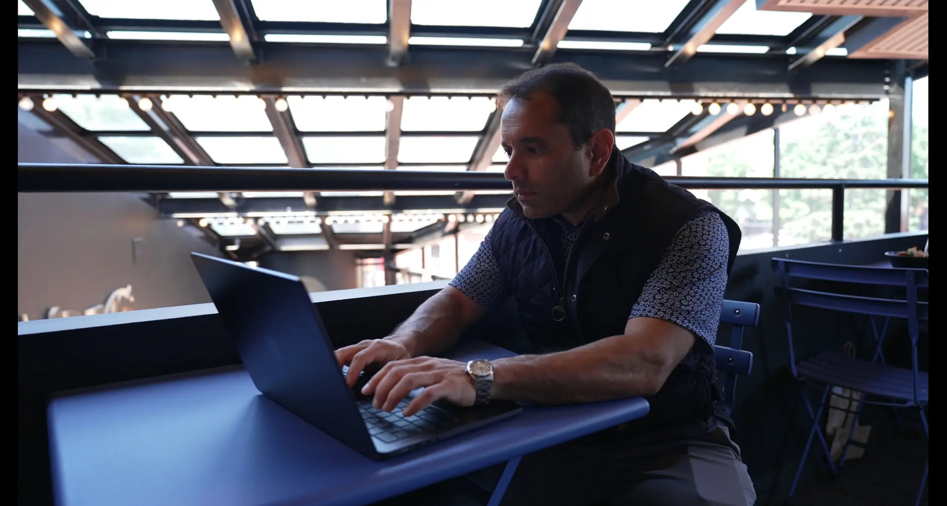 Nik Agharkar working on his laptop